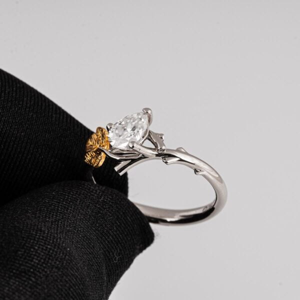 Twig and Fig Leaf Pear Moissanite Ring Platinum and Gold Catalogue