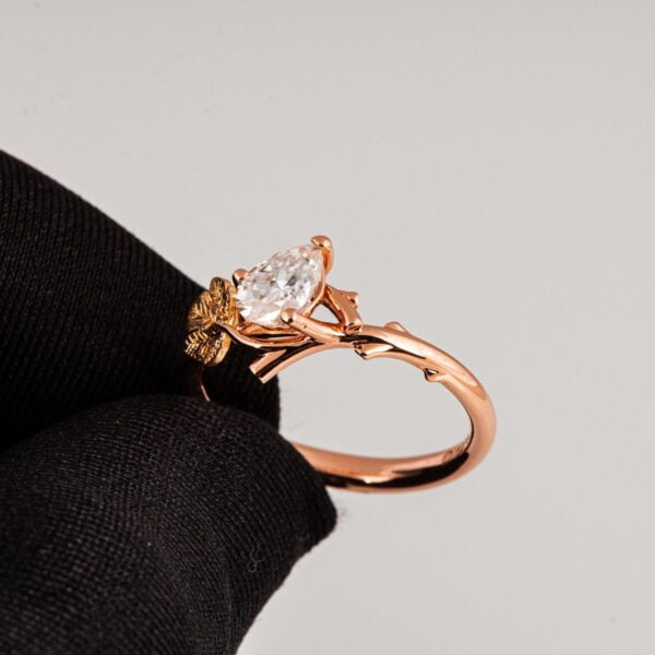 Twig and Fig Leaf Pear Moissanite Ring Rose and Yellow Gold Catalogue