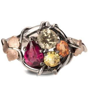Platinum and Rose Gold Multi-Stone Twig and Leaf Engagement Ring with a Cluster of Ruby and Sapphires Catalogue