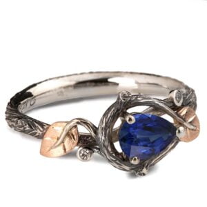 Platinum and Rose Gold Twig and Leaves Pear Cut Blue Sapphire Engagament Ring Catalogue