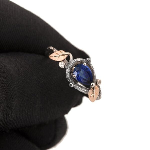 Platinum and Rose Gold Twig and Leaves Pear Cut Blue Sapphire Engagament Ring Catalogue